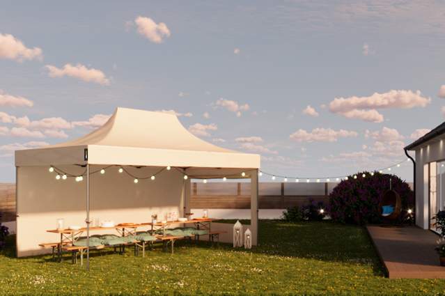 Large pop-up canopy set up in a garden with string lights and dining area