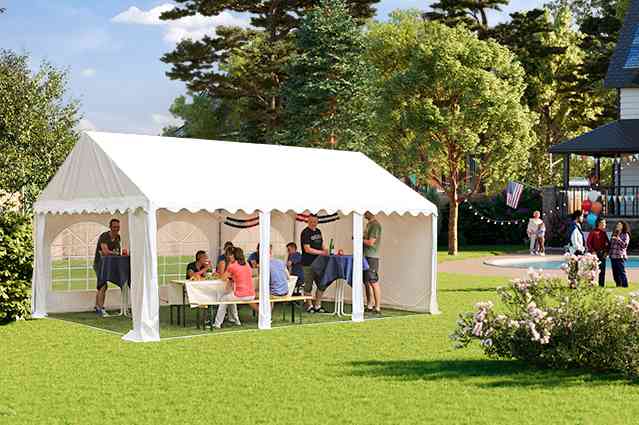 people sheltering under a party tent in a backyard with pool