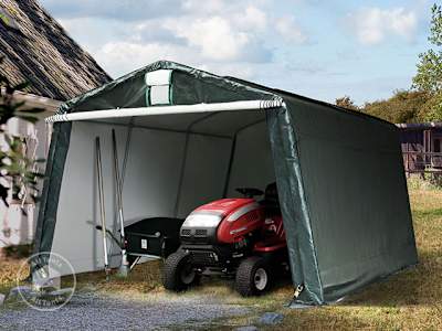 Portable shed used for garden equipment storage on a lawn