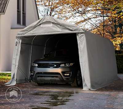 portable garage tent sheltering an SUV in a driveway