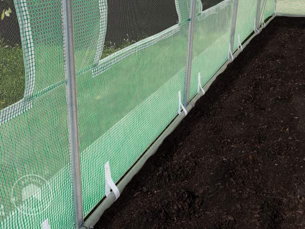 Steel ground frame rail stabilizing hoop house greenhouse structure