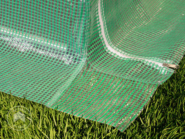 Extended PE ground skirt on hoop house greenhouse with reinforced edging