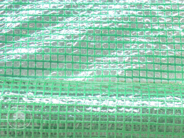 Close-up of reinforced PE greenhouse plastic with woven grid structure