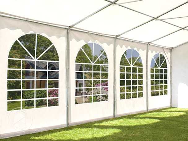 Close-up of arched window sidewalls inside a large outdoor event tent